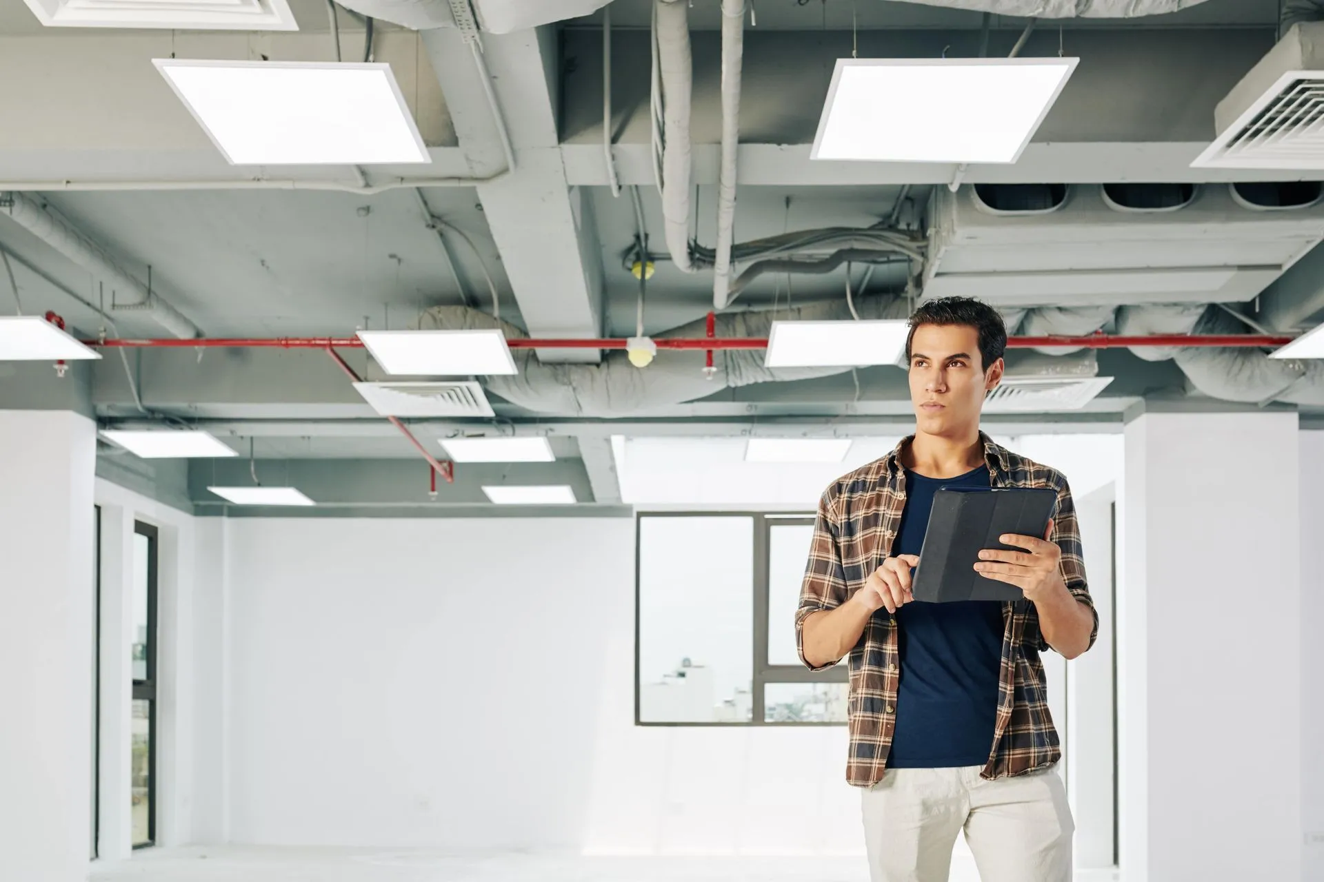 HVAC service technician evaluating options for the best home repair solution.