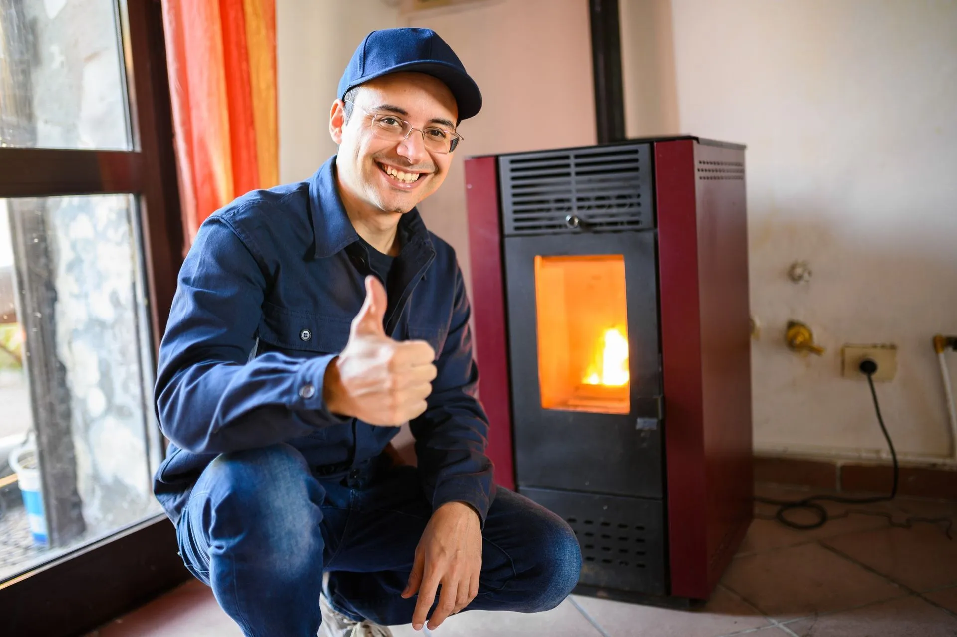 A technician from Reid Heating & Air performing a furnace installation
