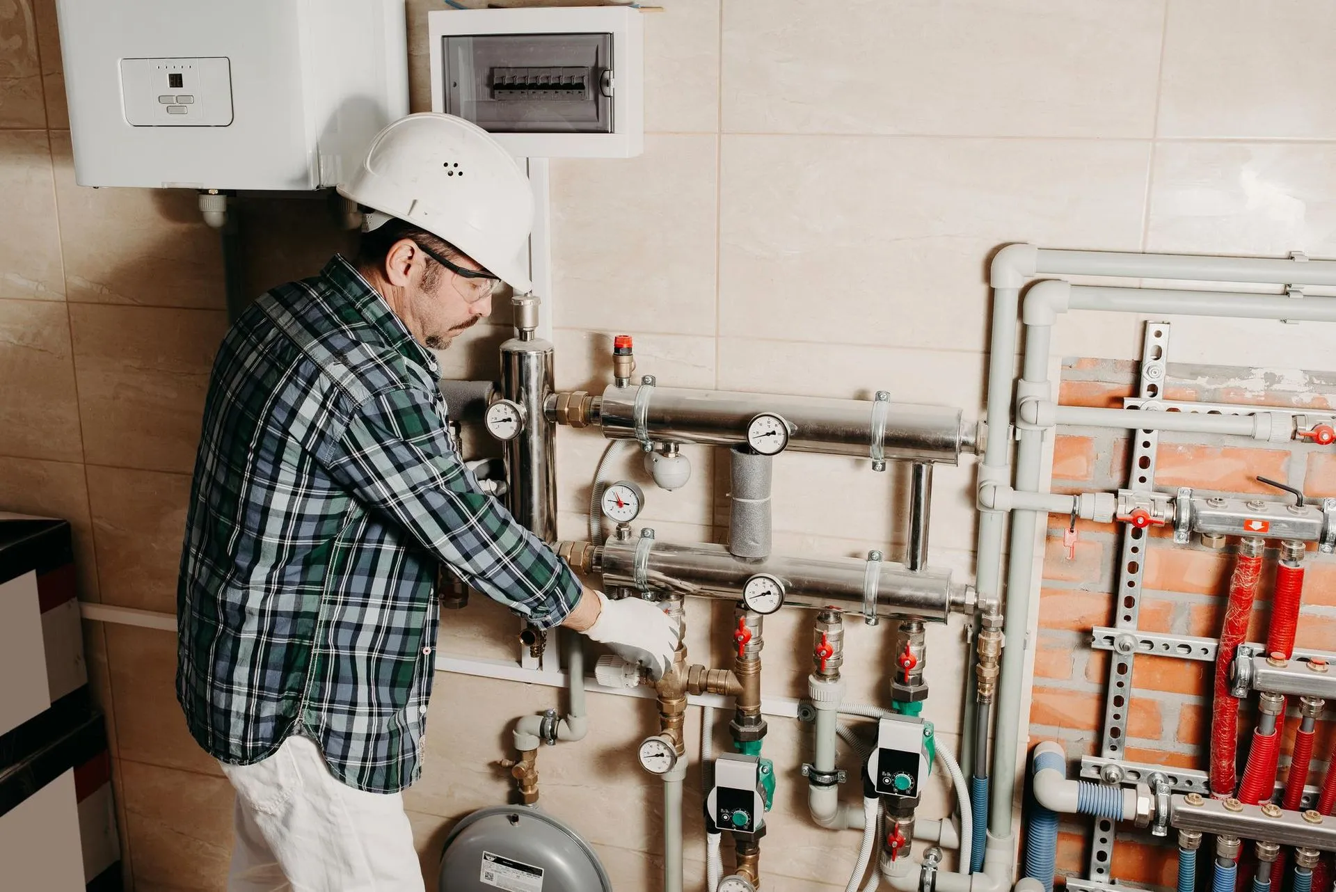A technician from Reid Heating & Air performing a heating system replacement.