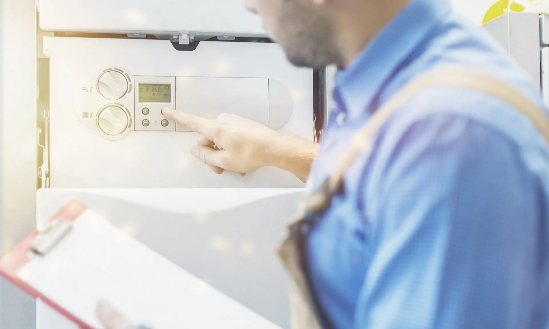 Wall-mounted tankless water heater installed inside a home utility closet.